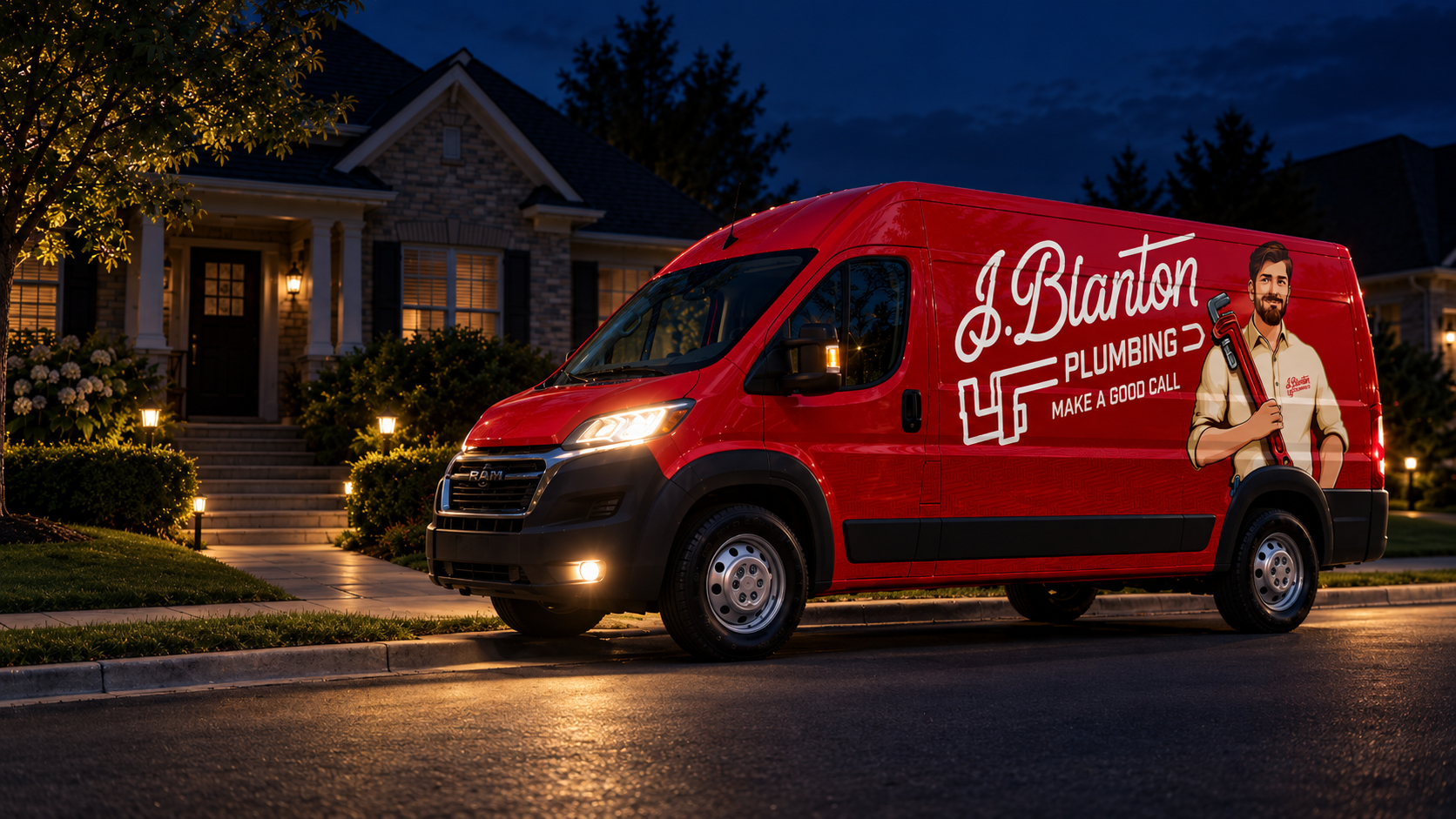 Red J. Blanton Plumbing service van parked on a suburban street at night, headlights on, with a warmly lit home in the background